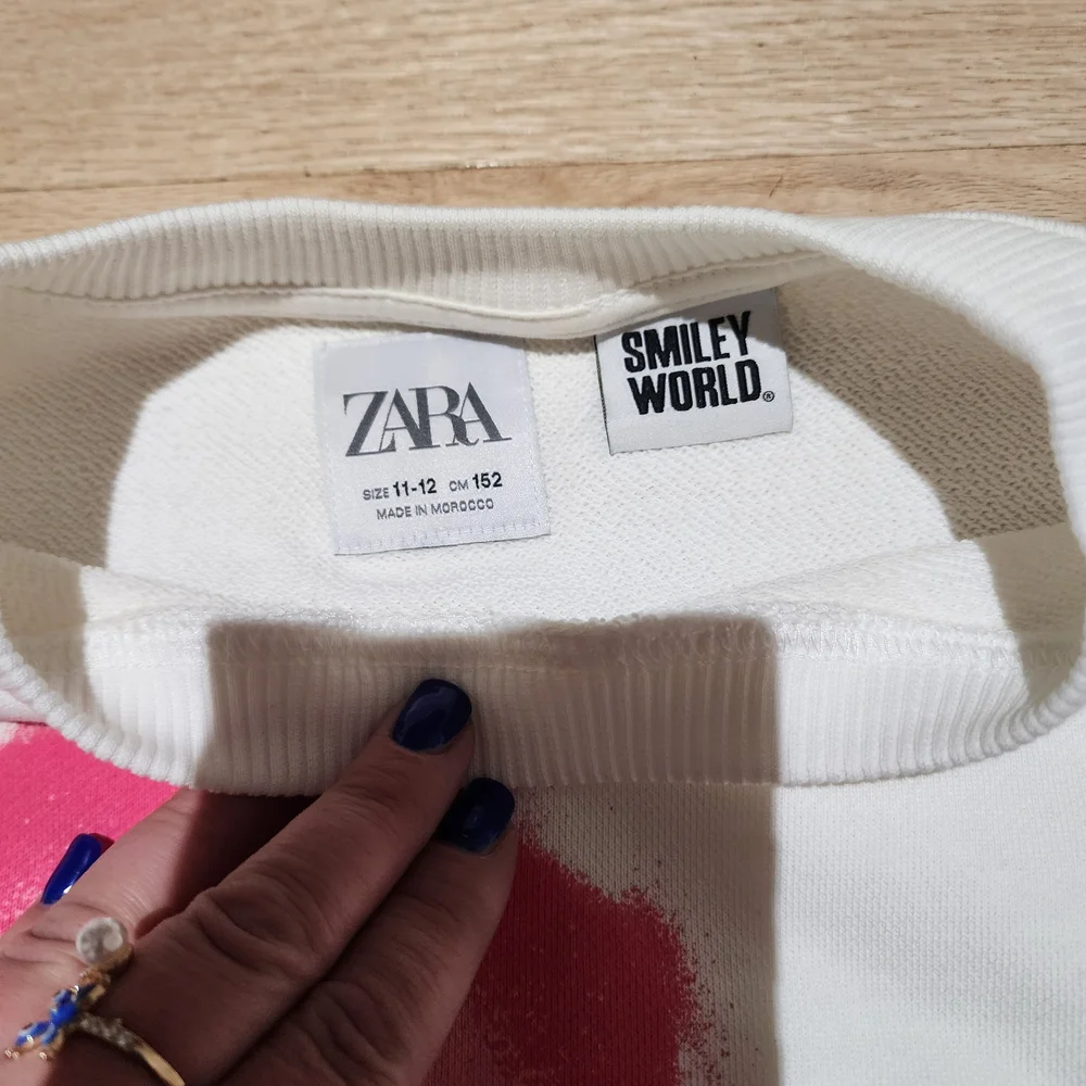 Zara Kids White Sweatshirt with Pink and Purple Smiley Faces